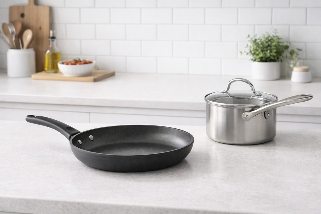Frying pan and saucepan placed on a bright kitchen counter in a simple everyday cooking setup